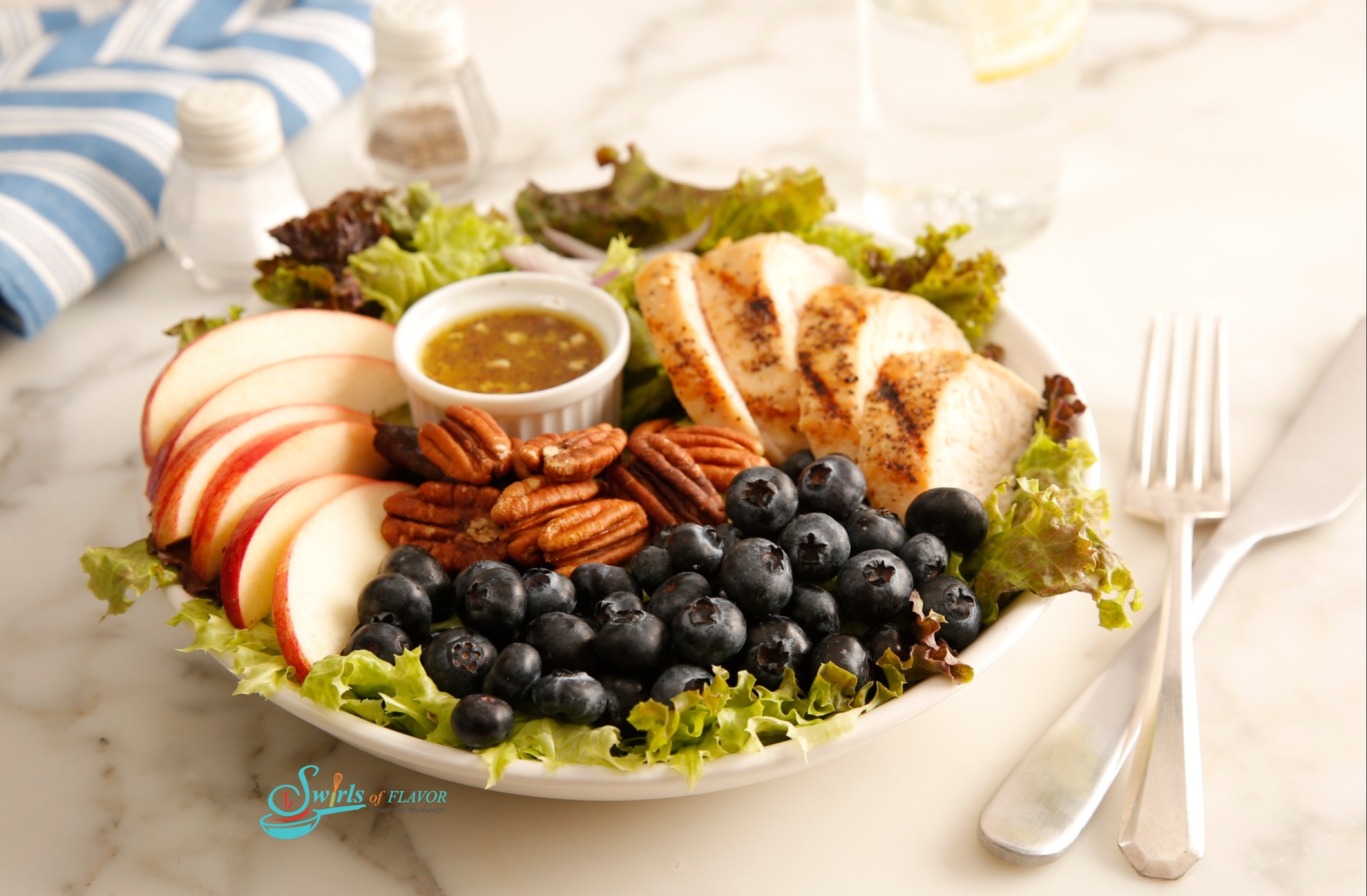 Arranged apple pecan chicken salad in round bowl