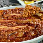baked beans with bacon and spoonful of beans