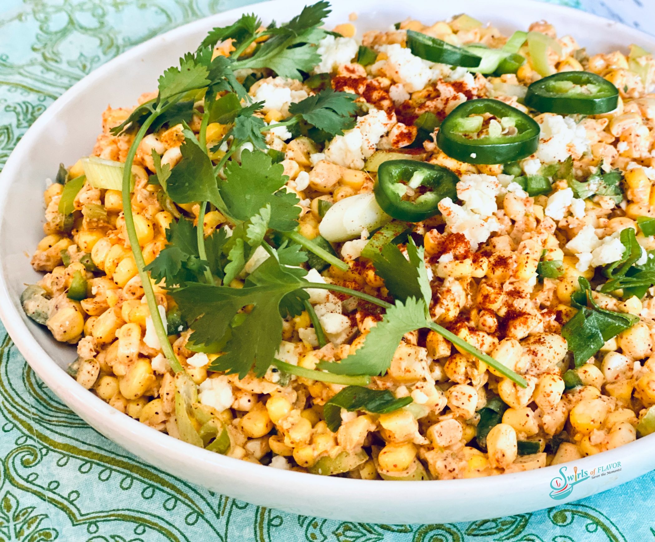 corn, jlapeno and cheese in white bowl