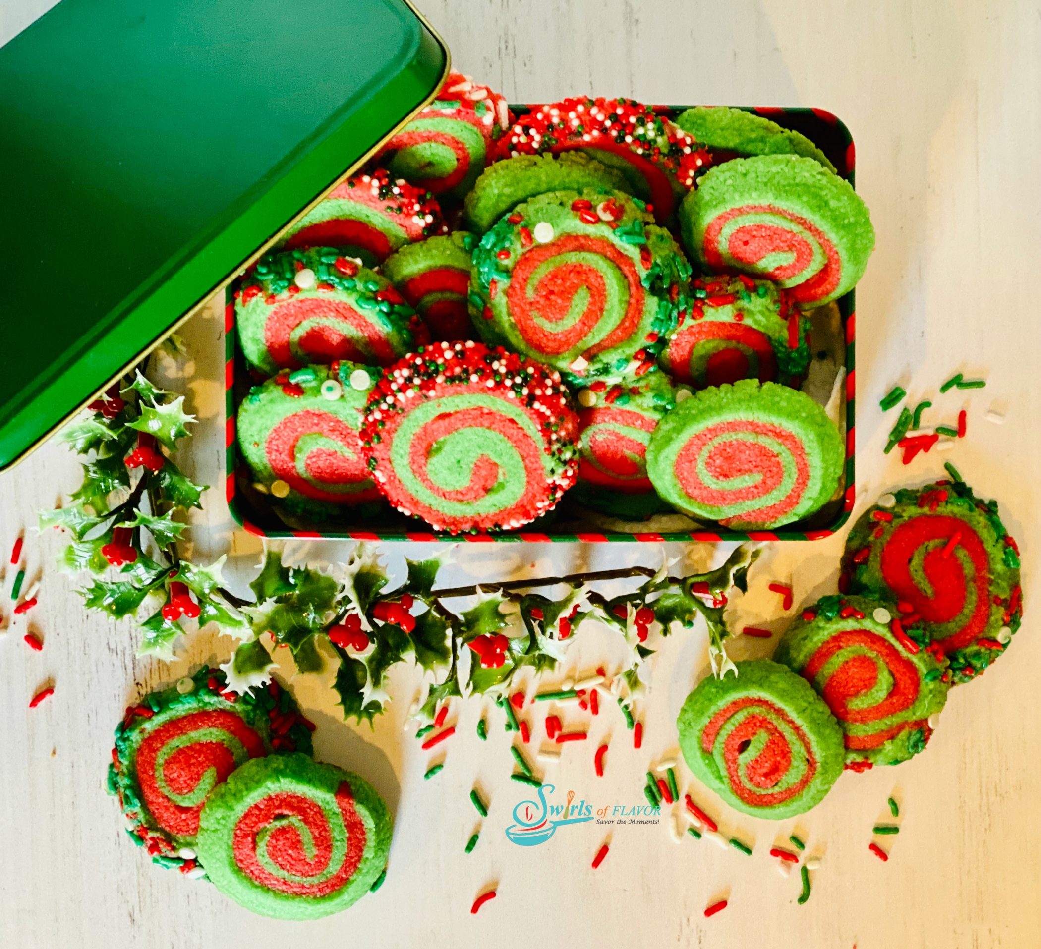 overhead picture of cookie tin filled with red and green spiral cookies