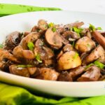 bowl of mushrooms with parsley