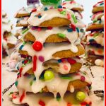cookies stacked up to look like a Christmas tree with icing and sprinkles and text overlay