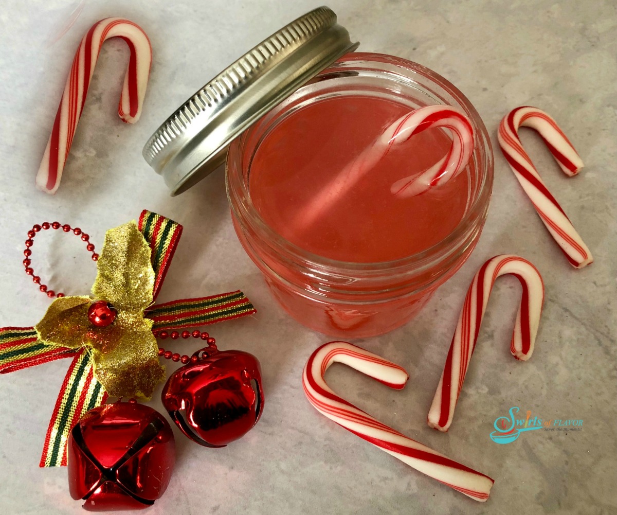 candy cane vodka in mason jar with mini candy canes