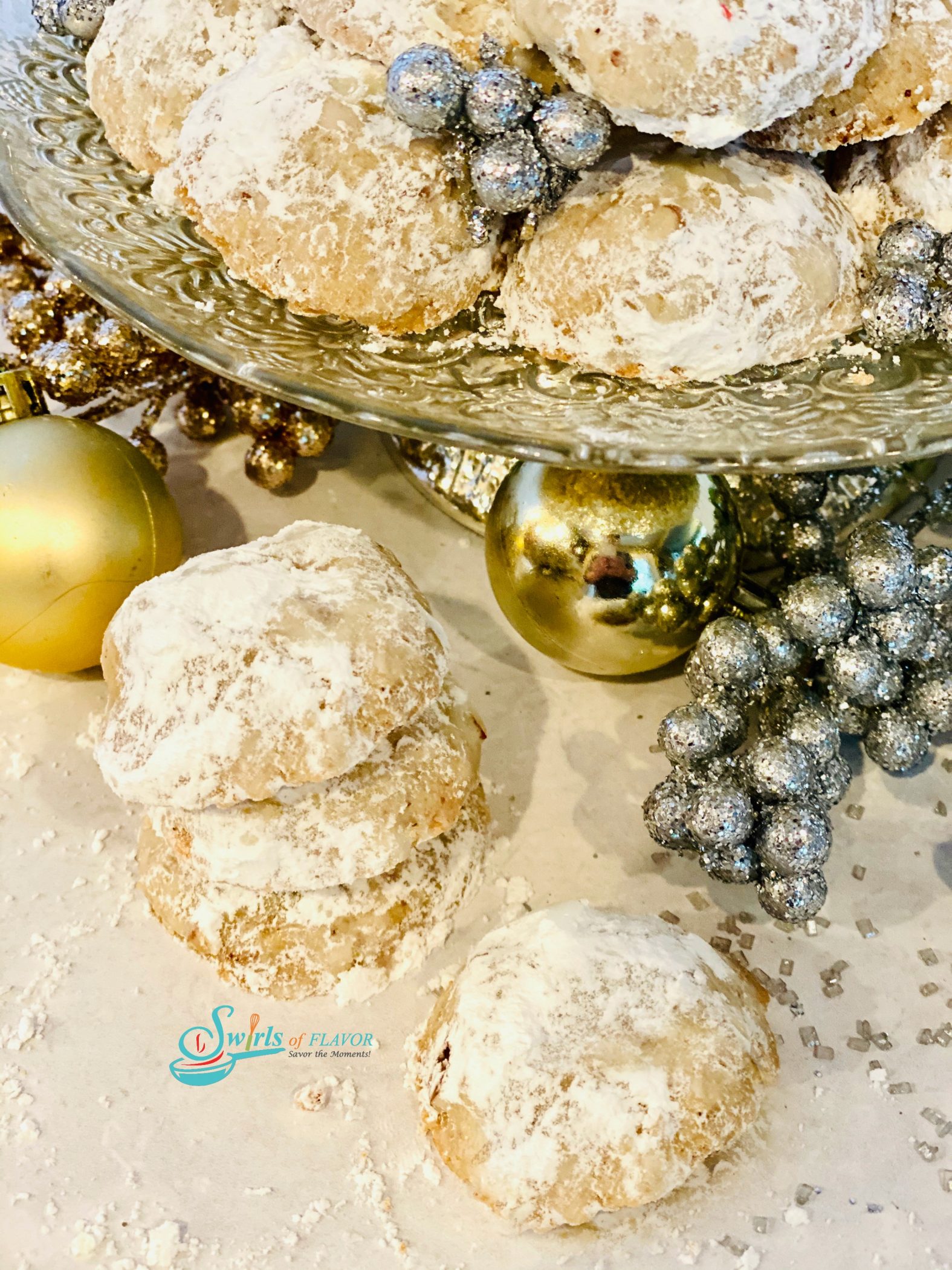 stack of snowball cookie recipe with cookies on cake stand