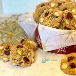 oatmeal cookies with tin of cookies and glitter snowflake