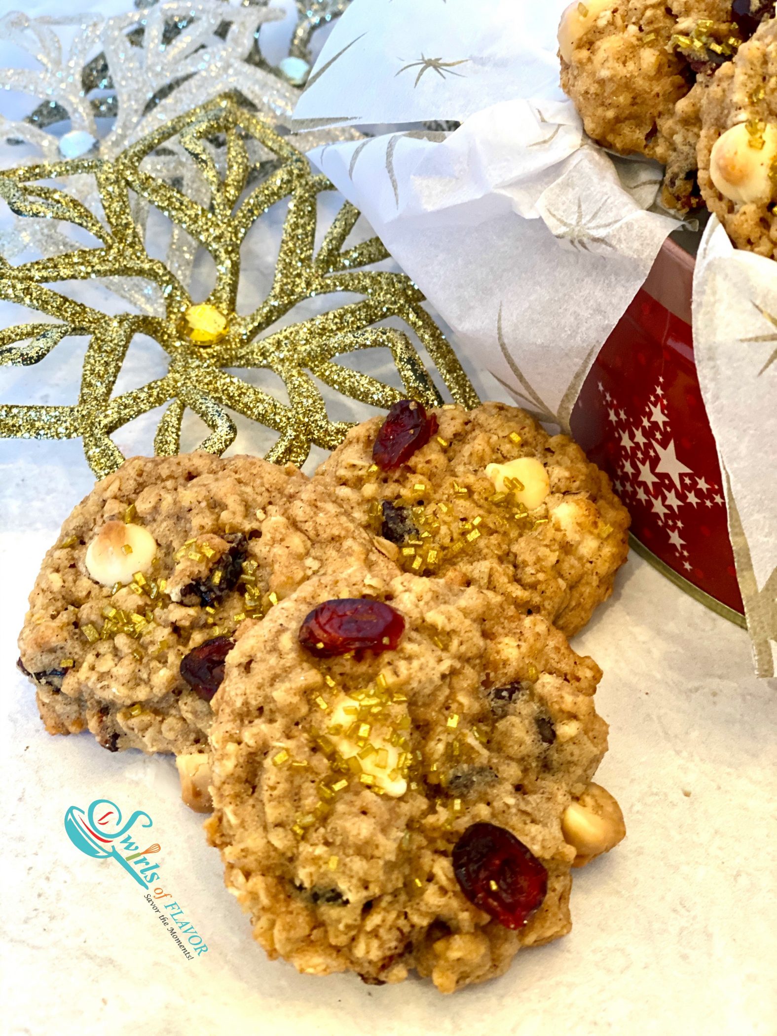 close up of three white chocolate cranberry cookies