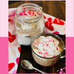 hot chocolate mix and mug of hot chocolate with whipped cream and sprinkles and text overlay