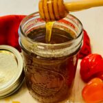 hot honey in mason jar with drizzle of honey