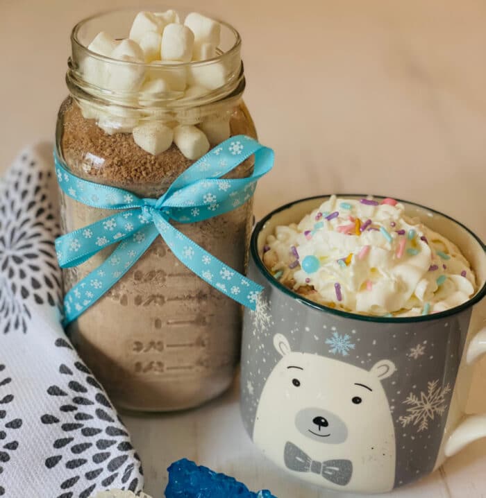 homemade hot chocolate mix in a jar with mug of hot chocolate