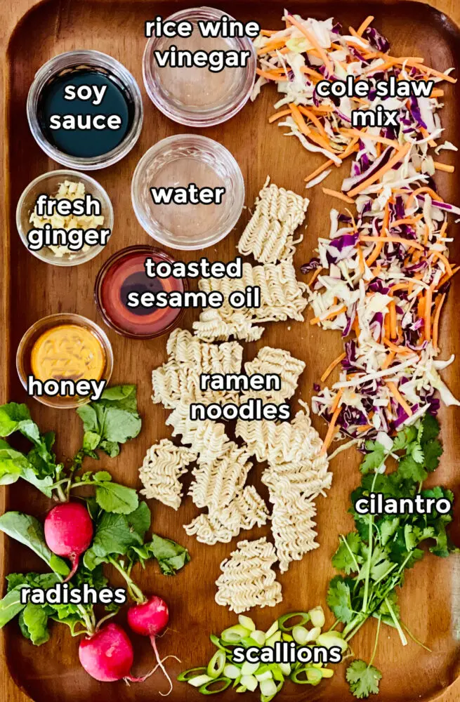 ingredients on a wooden board to make ramen noodle salad