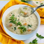creamy chicken soup in a bowl with spoon and text overlay