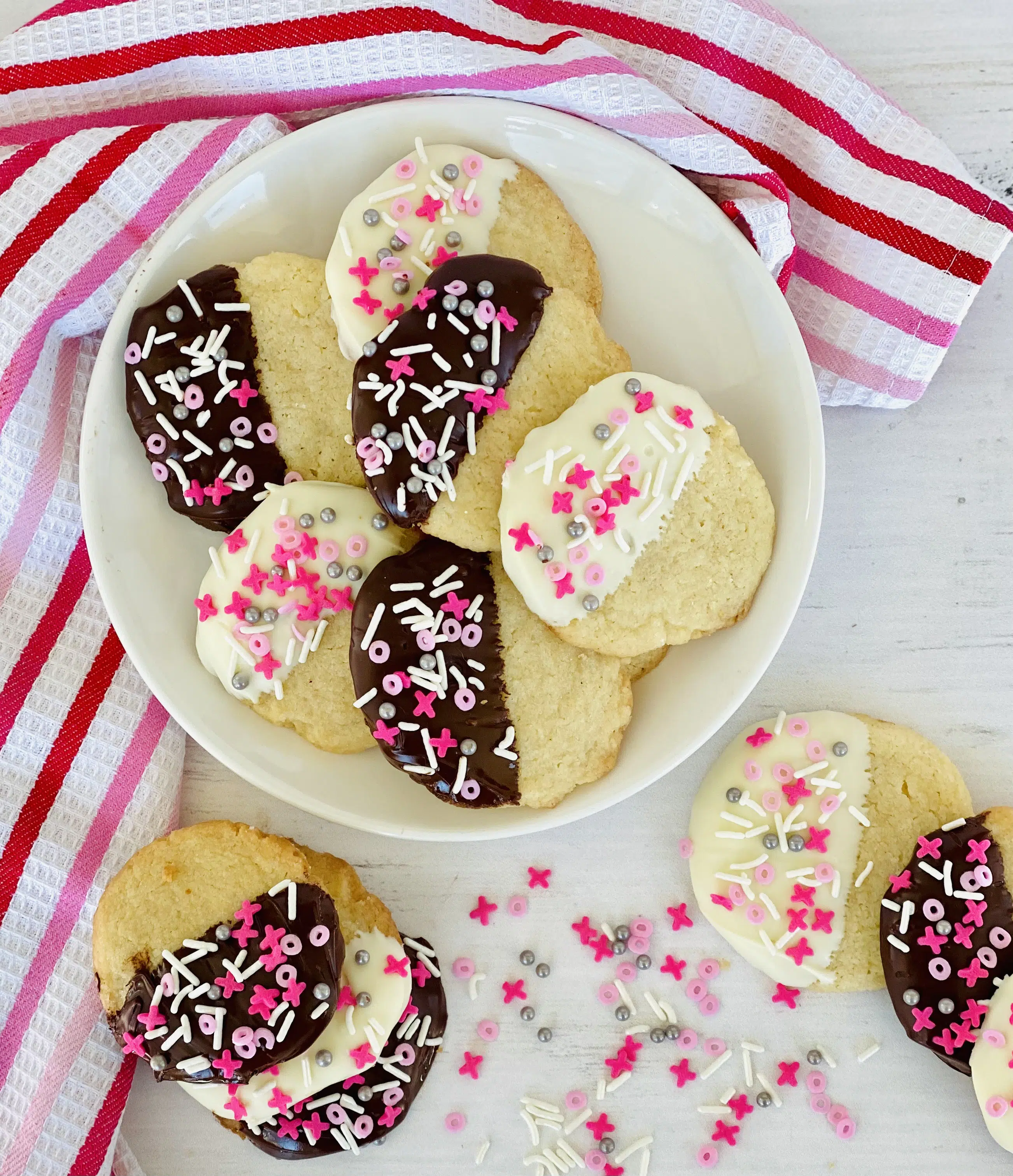 cookies with valentine sprinkles on a dish