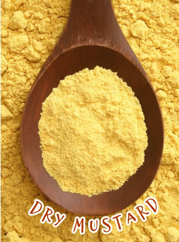 dry mustard on a wooden spoon