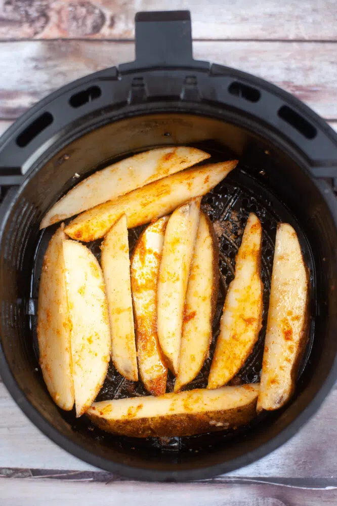 potato wedges in the air fryer before cooking