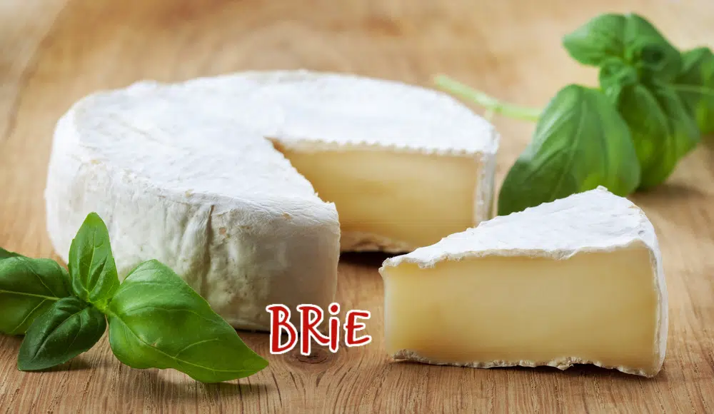 round of Brie cheese with wedge