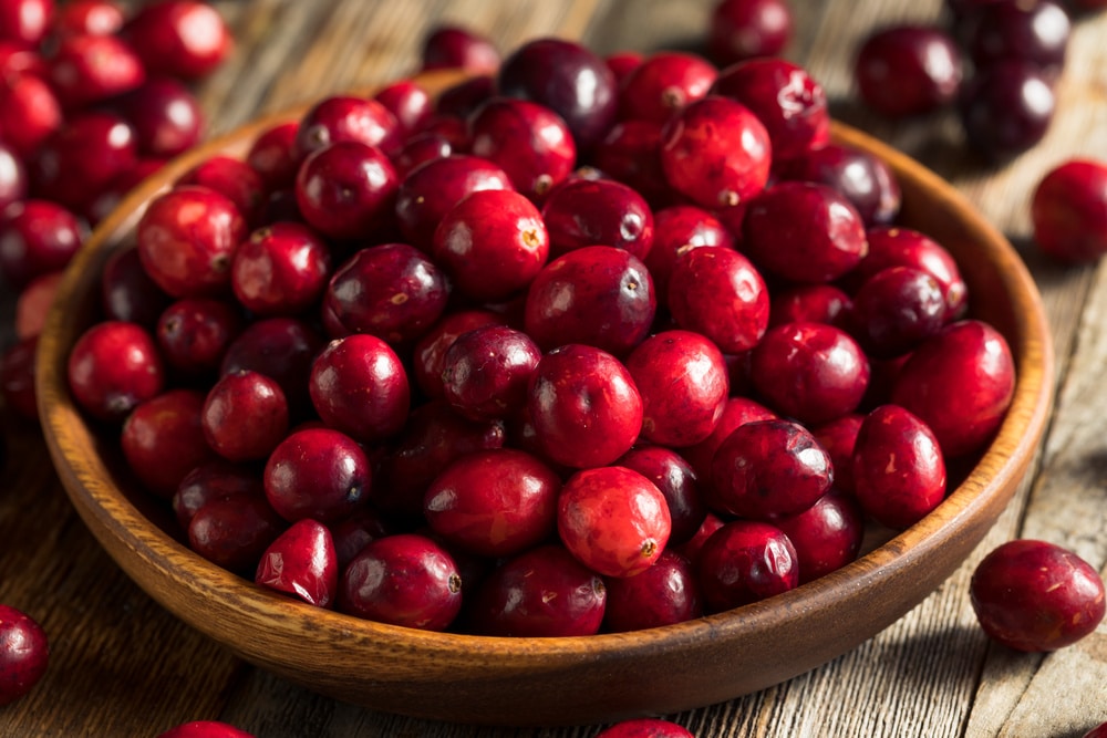 fresh cranberries in a wooden bowl