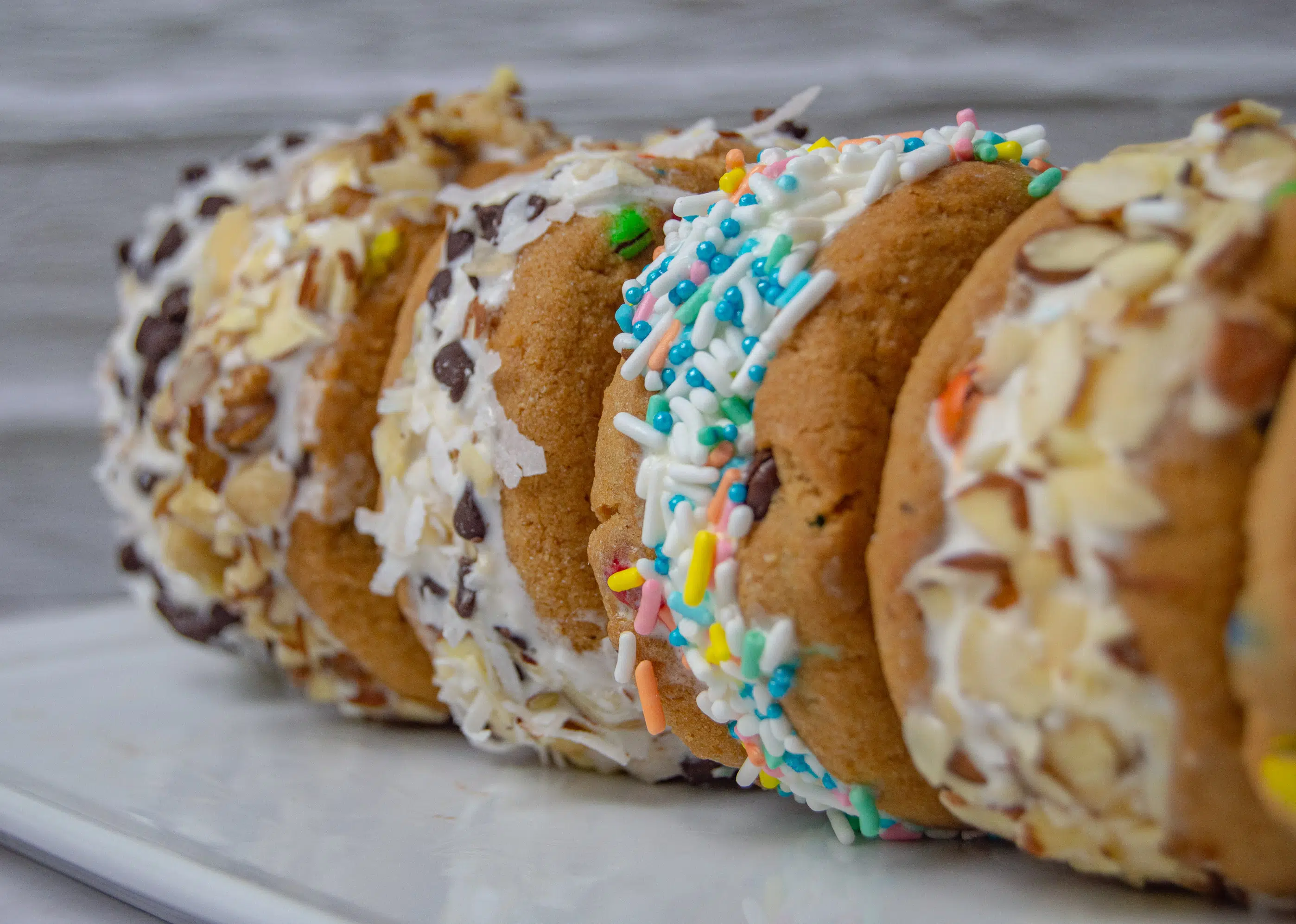 M&M cookie ice cream sandwiches on a plate