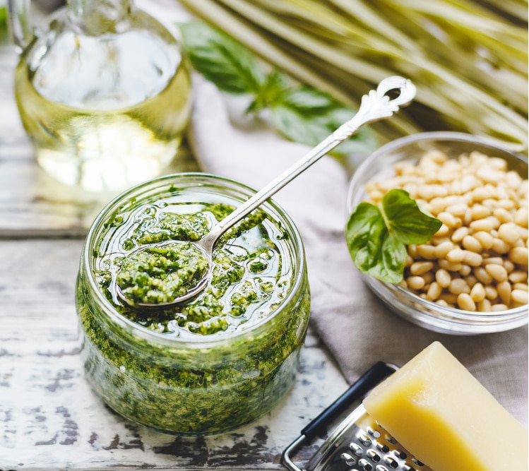 jar of pesto with a spoon