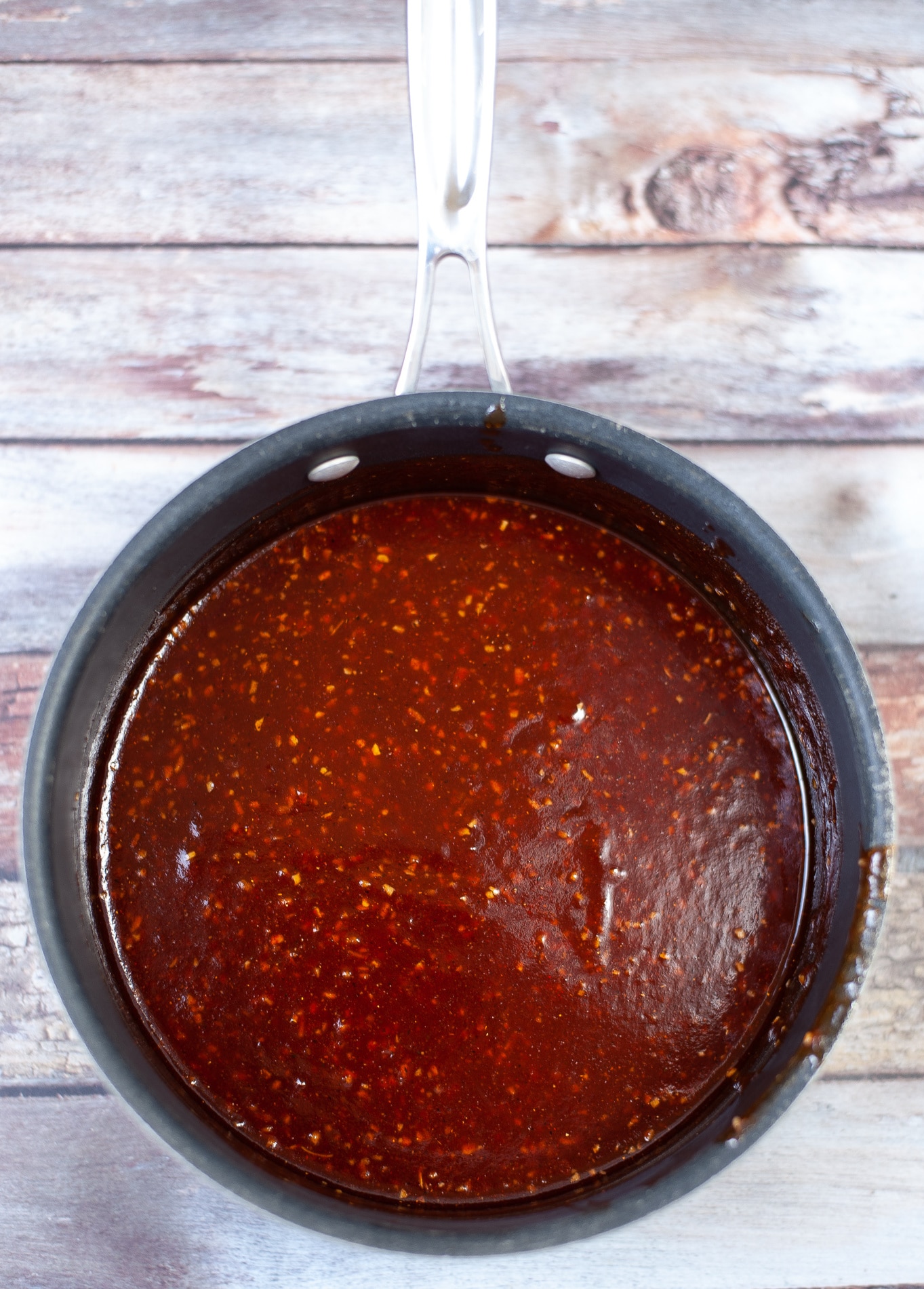 cooking BBQ sauce in a pot