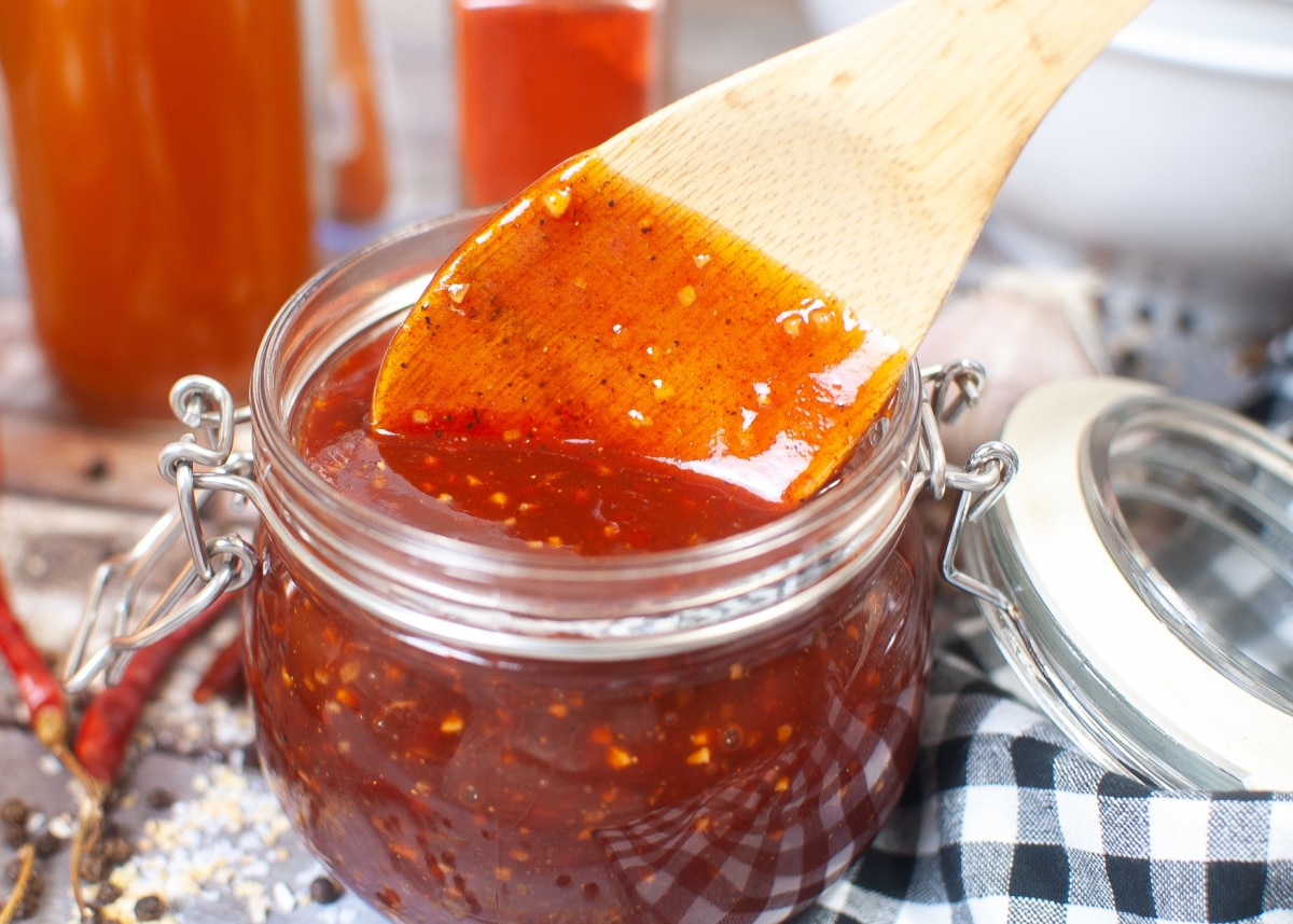homemade barbecue sauce with wooden spoon