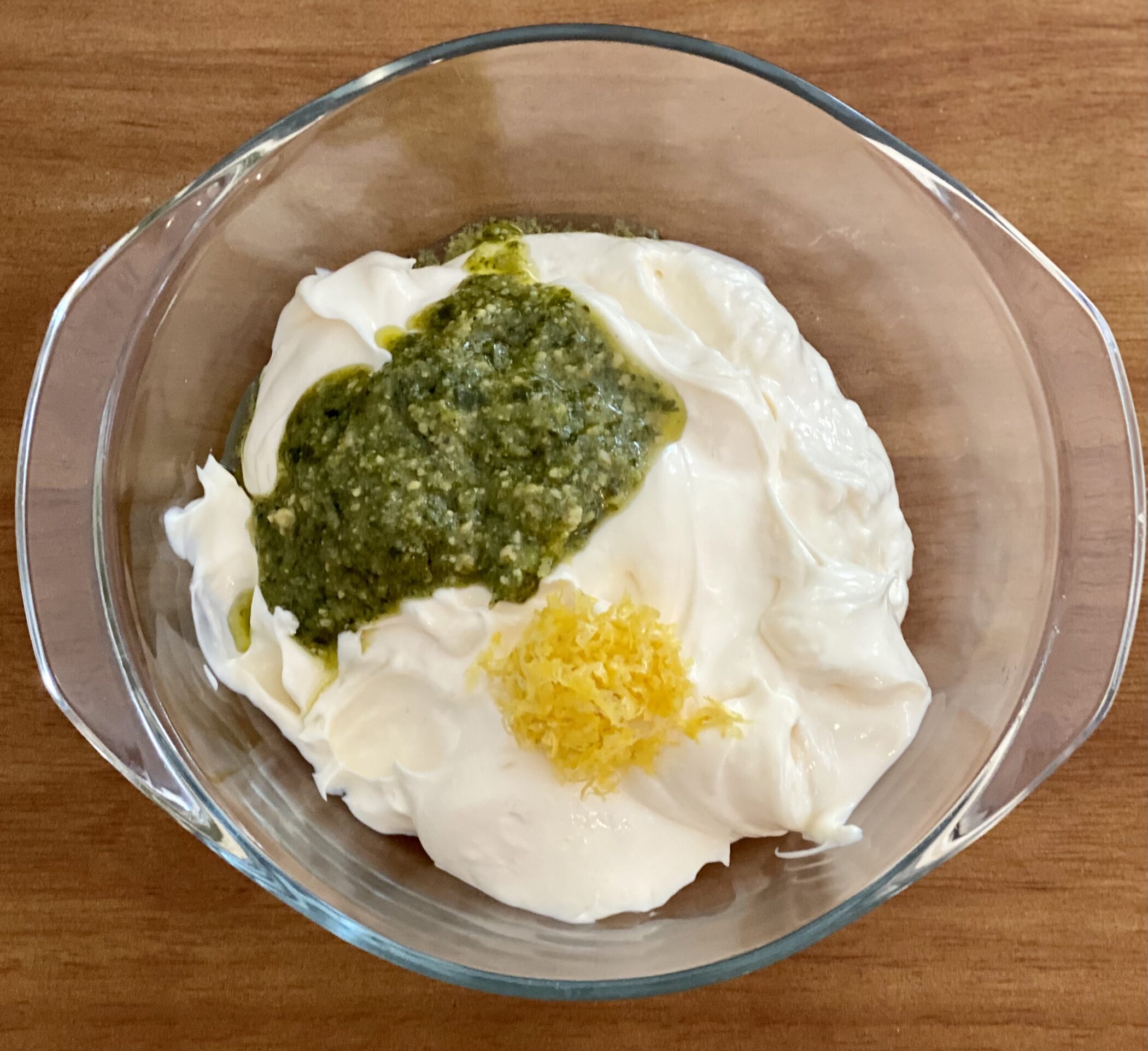 mayonnaise, pesto and lemon zest in bowl
