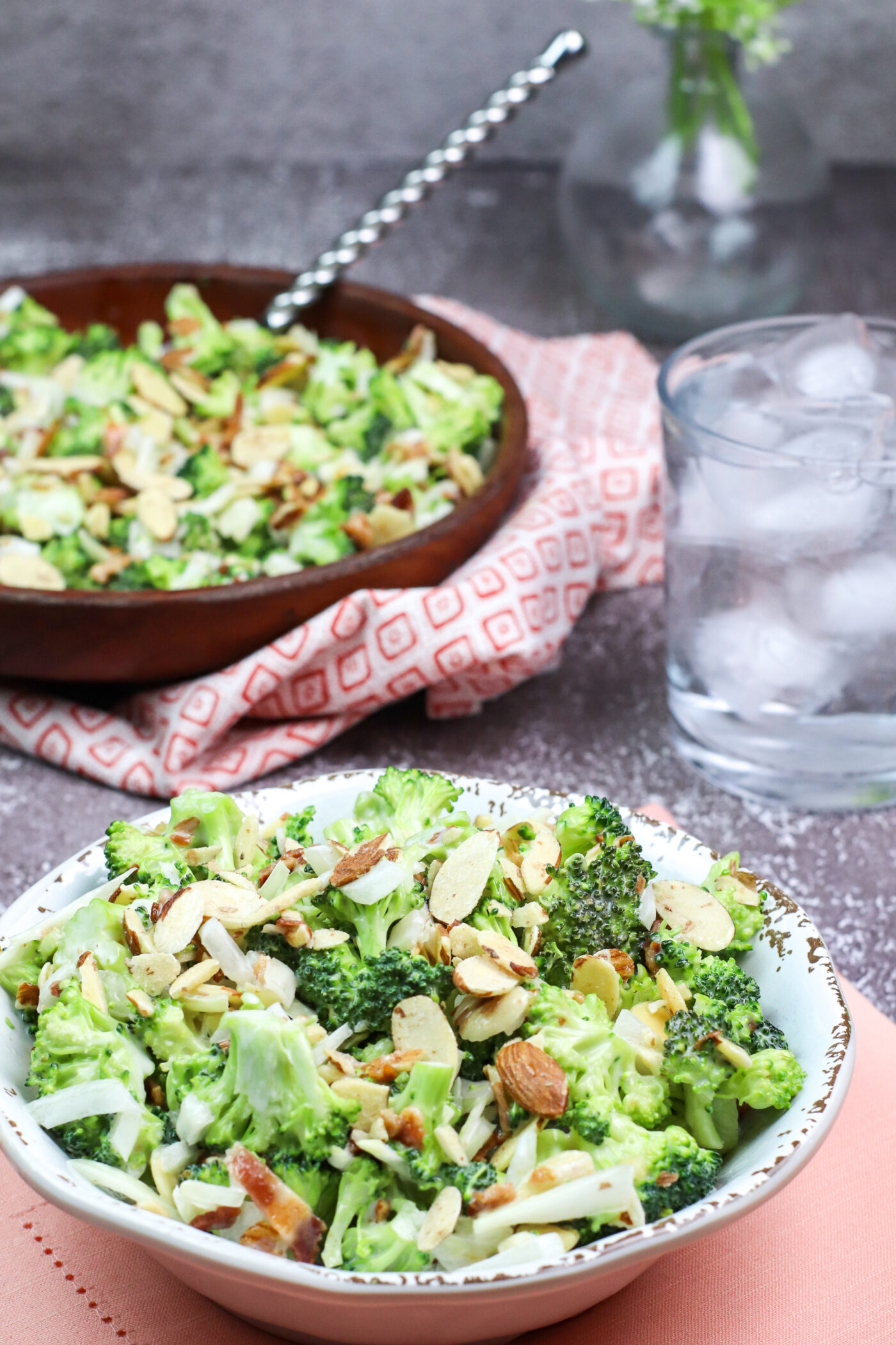 two dishes of broccoli salad