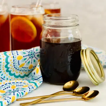 brown sugar simple syrup in a mason jar with spoons