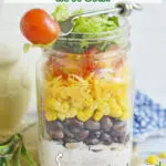 Mexican chicken salad in a jar with text overlay
