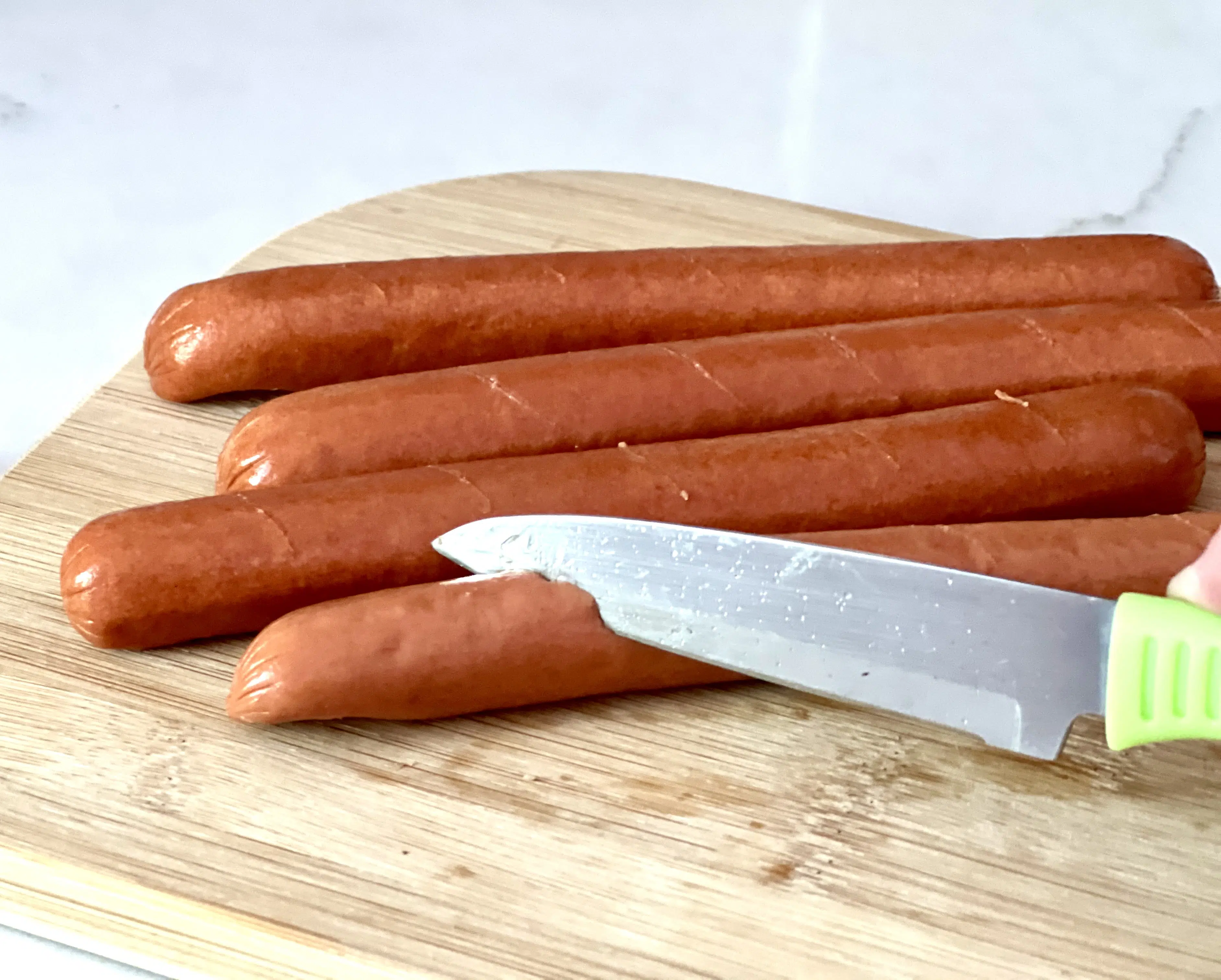cutting slits in hot dogs