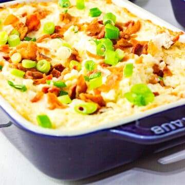 hot cheese dip in blue baking dish