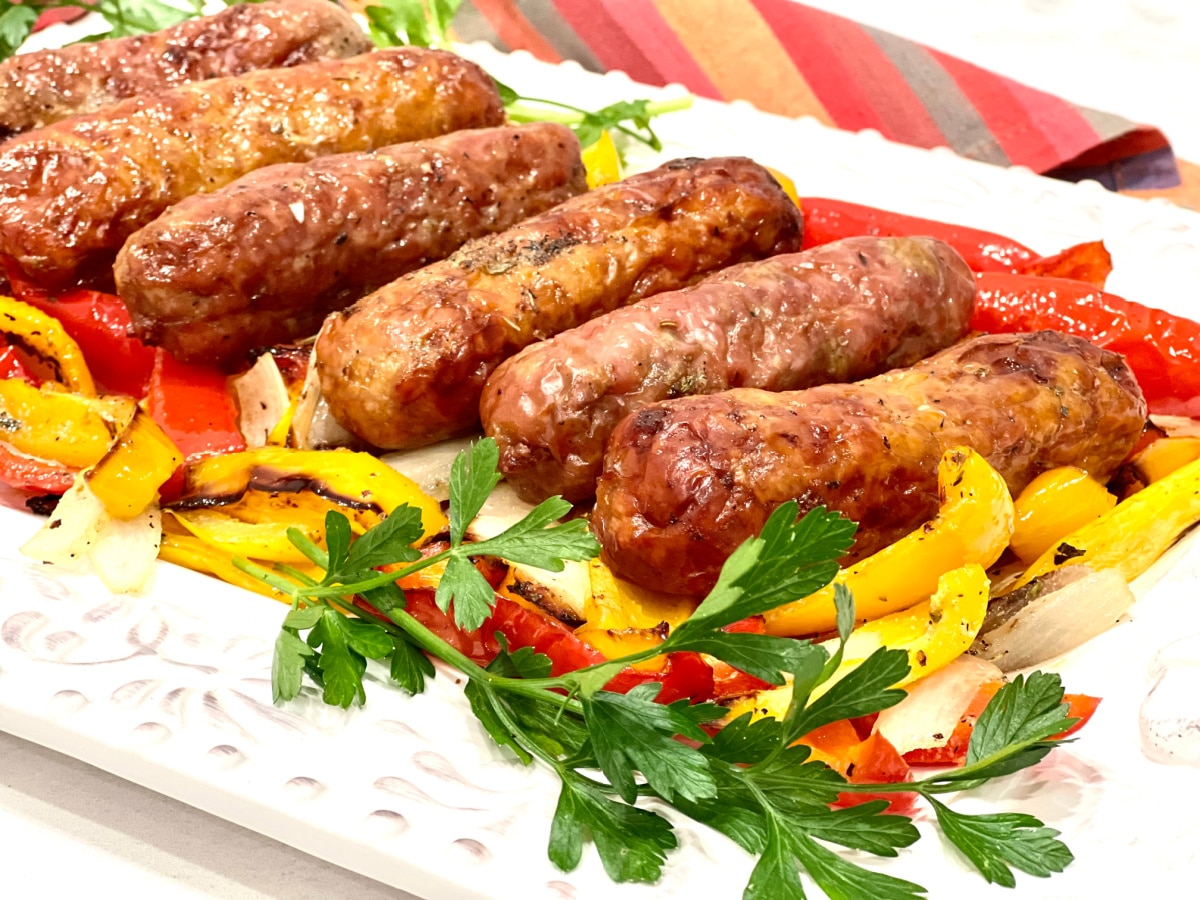 sausages and peppers on a platter
