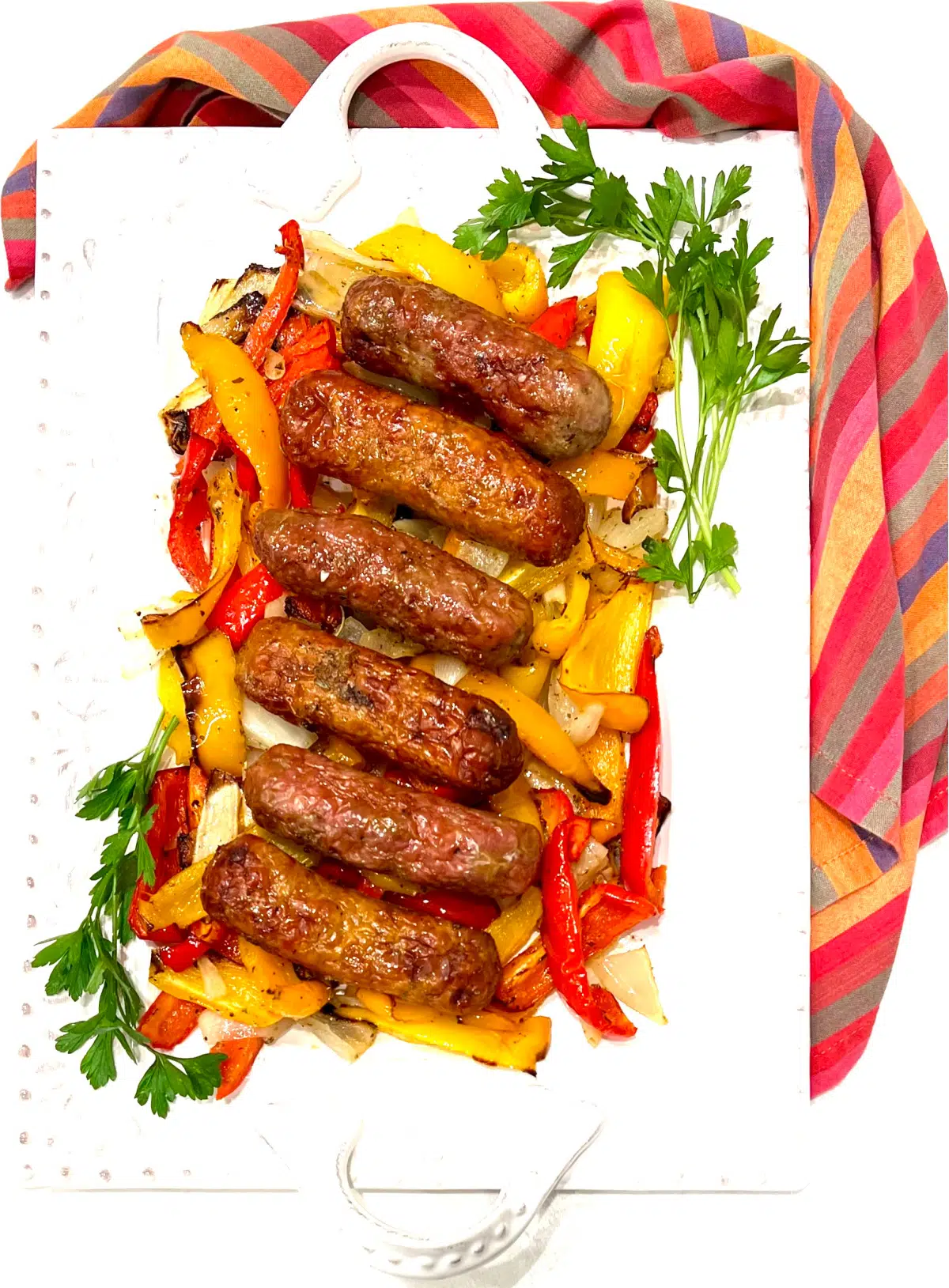sausages and peppers on a serving platter