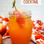 fireball and apple cider in a mason jar with text overlay