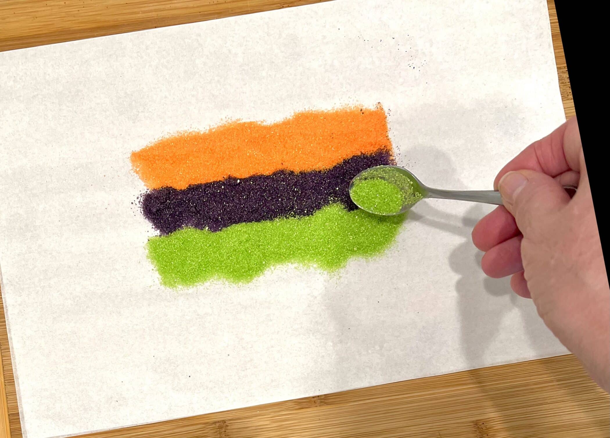 colored sugars on parchment paper