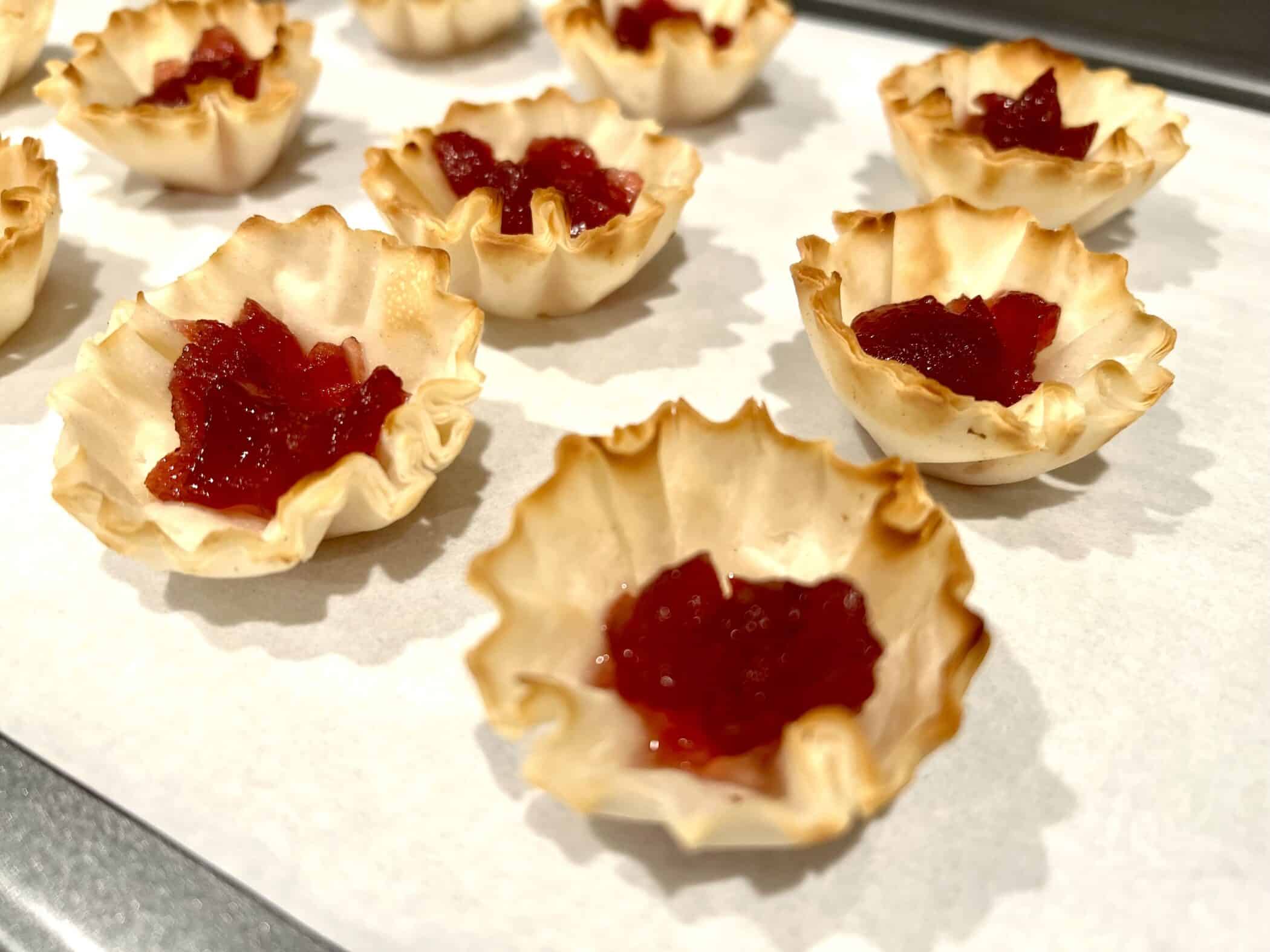 putting cranberry sauce in phyllo cups