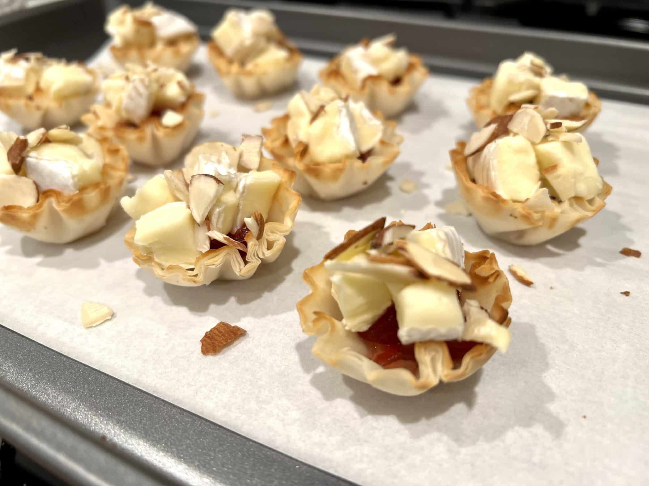 sliced almonds on top of Brie cups