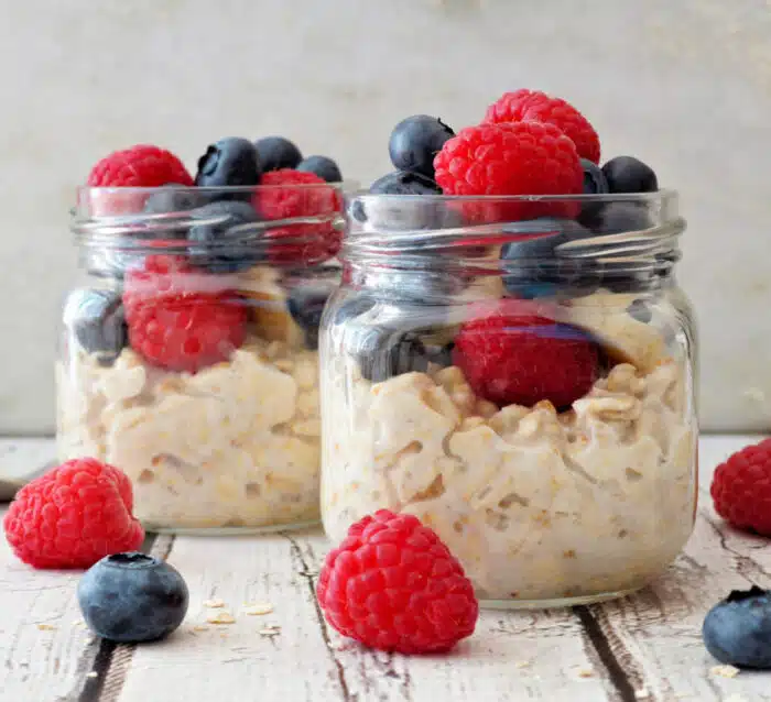 overnight oats with berries in mason jars