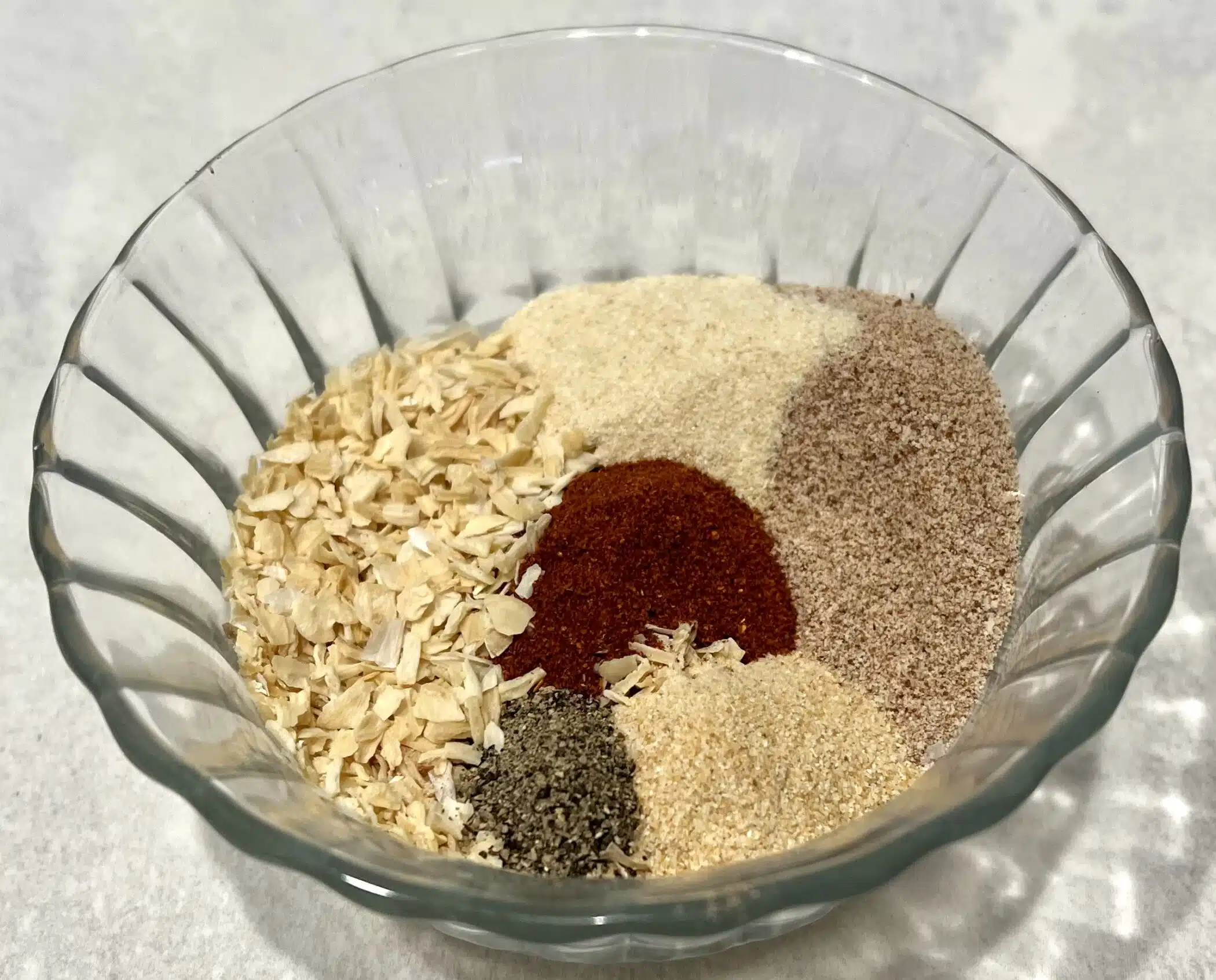 ingredients for onion soup mix in a glass bowl