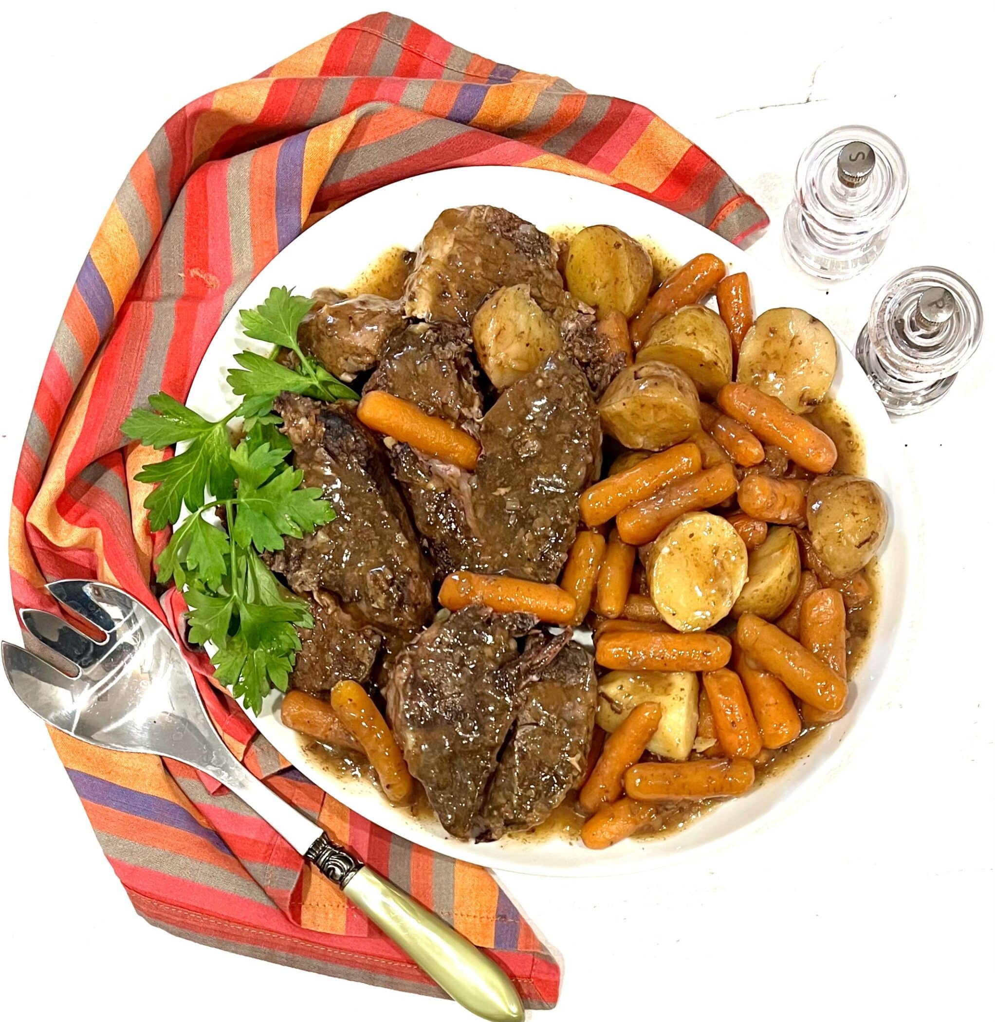 overhead photo of pot roast with carrots and potatoes