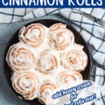 cinnamon rolls in a round pan with text overlay