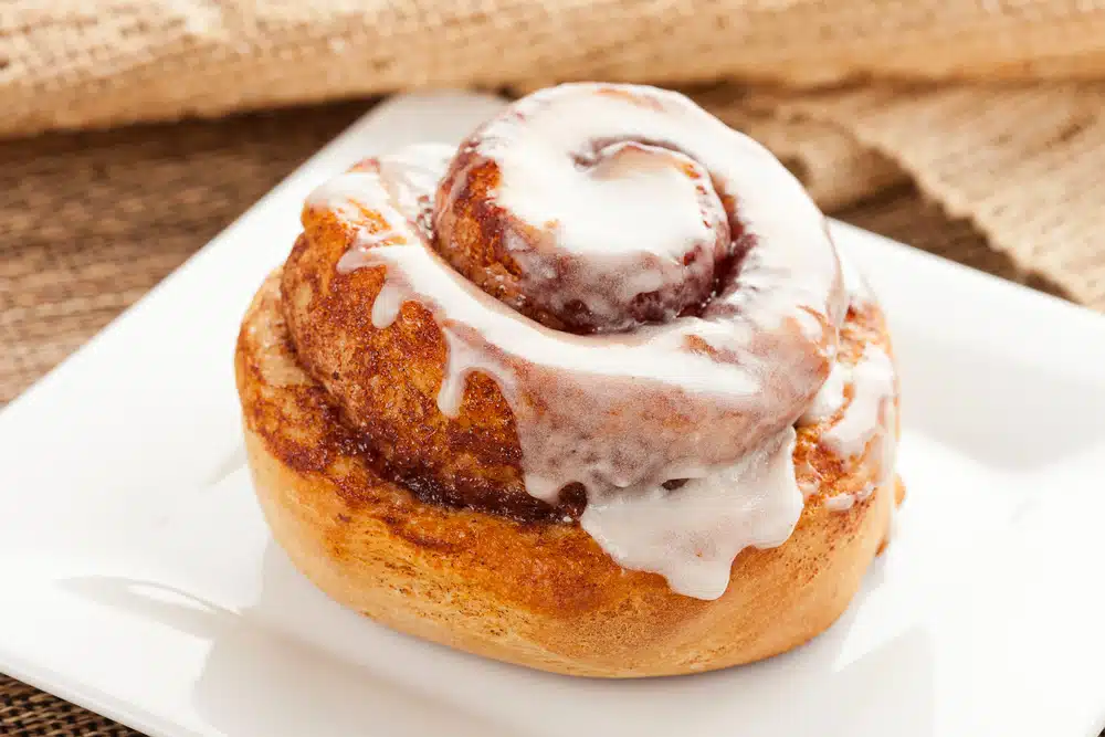 cinnamon roll on a white plate