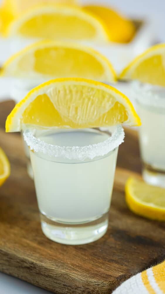 lemon drop in shot glasses with sugar rims and lemon wedges