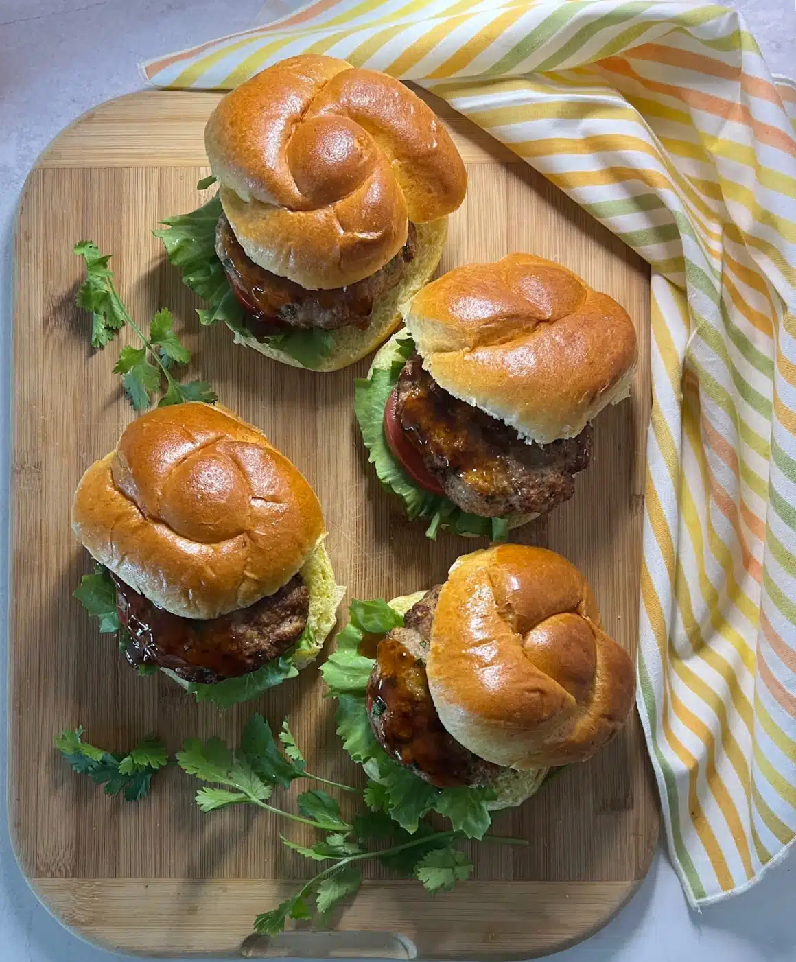 four hamburgers with cilantro