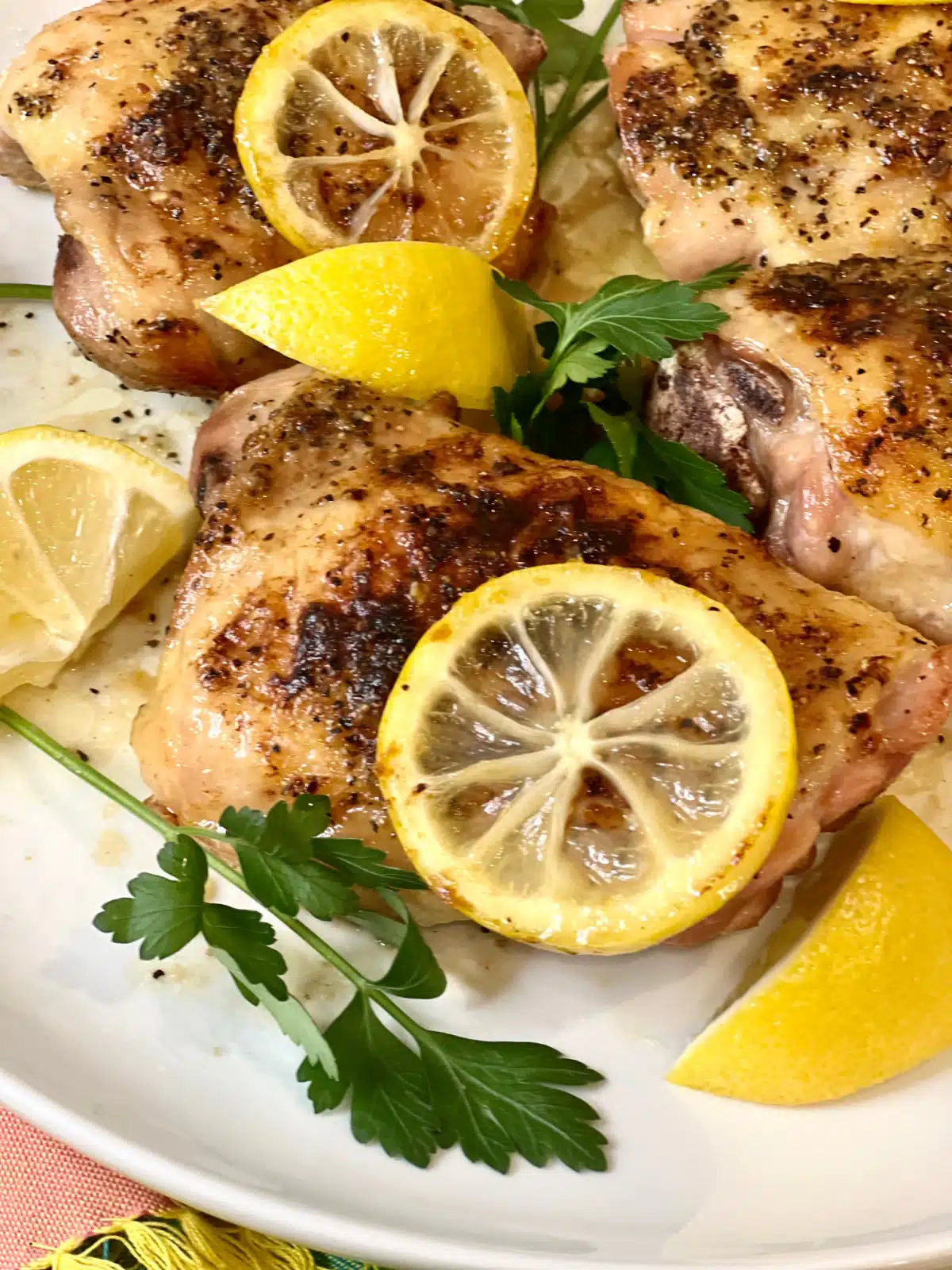 roasted chicken thigh with lemon slice