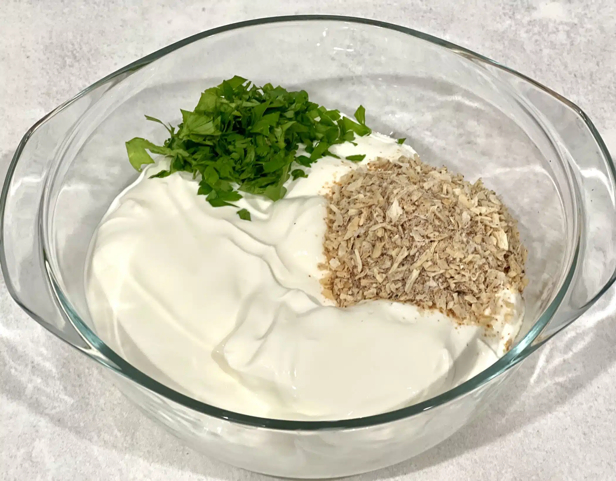 combining ingredients for dip in a bowl