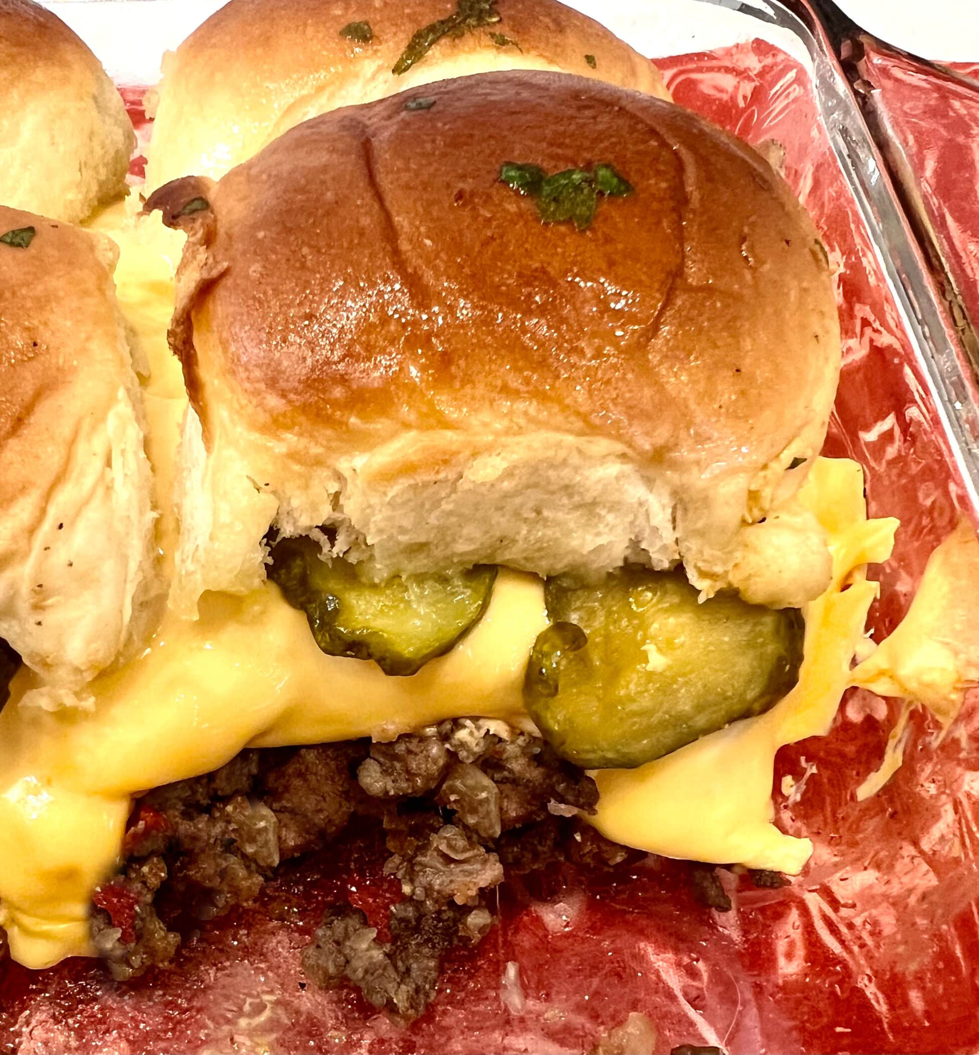 one slider with ground beef and pickles