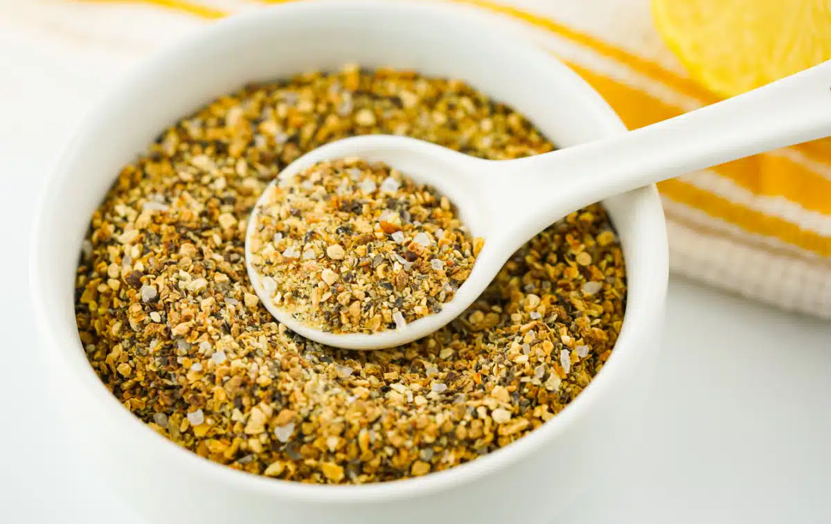 lemon pepper seasoning in a bowl with a spoon