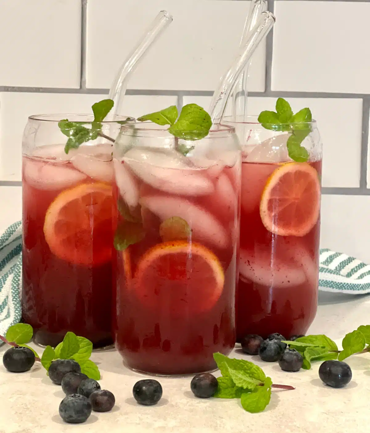 three glasses of blueberry vodka lemonade
