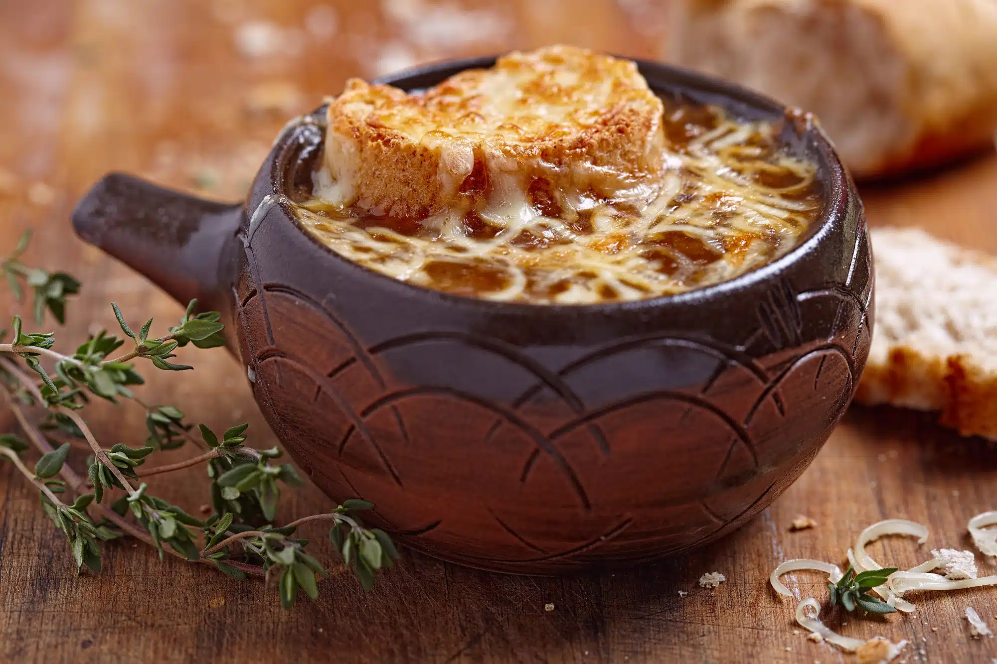 onion soup with croutons and cheese in an onion soup crock
