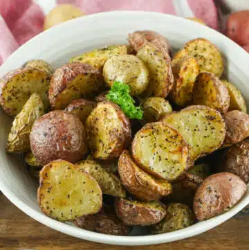 air fryer baby potatoes in a white bowl